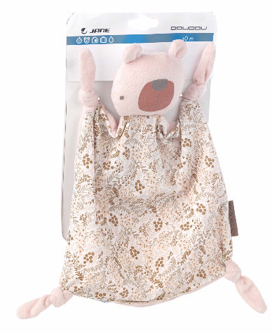 Plush toy pig in a floral-patterned bag with visible branding on a white background