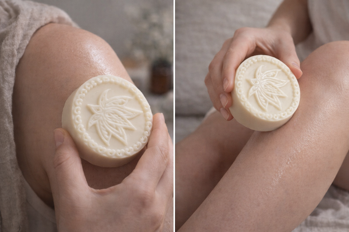 Two images showing a bar of soap with a leaf design being held against skin.