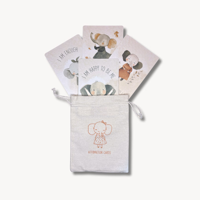Set of affirmation cards with illustrations in a drawstring pouch on a white background