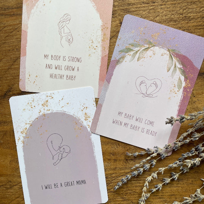 Three motivational cards on a wooden surface with lavender flowers.