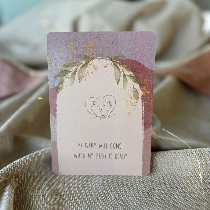 Card with floral design and text on a textured fabric background