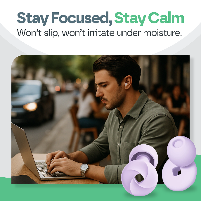 Man using a laptop with purple earplugs on a blurred street background, featuring text 'Stay Focused, Stay Calm'.