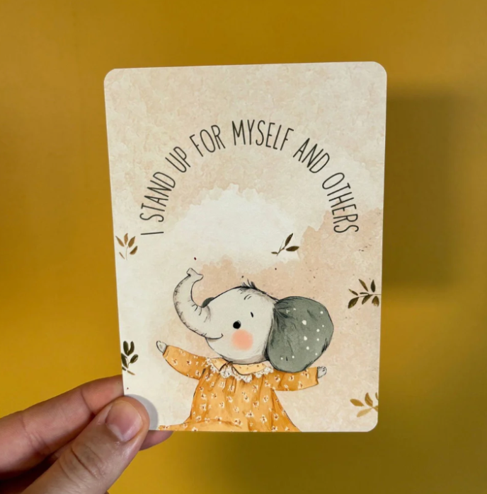 Card with an illustration of an elephant and text on a yellow background