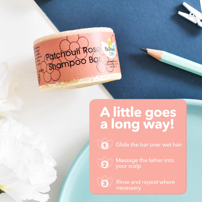 Patchouli Rose Shampoo Bar with usage instructions on a blue surface