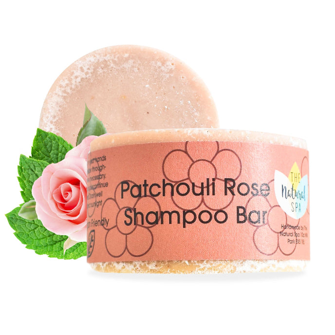 Patchouli Rose Shampoo Bar with packaging featuring a rose and mint leaf on a white background