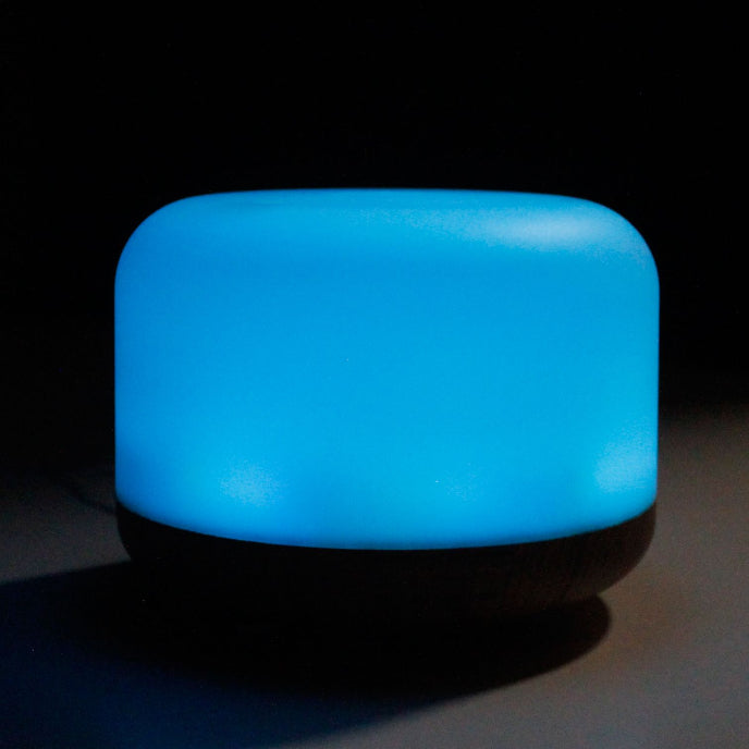 Blue glowing cube on a dark background