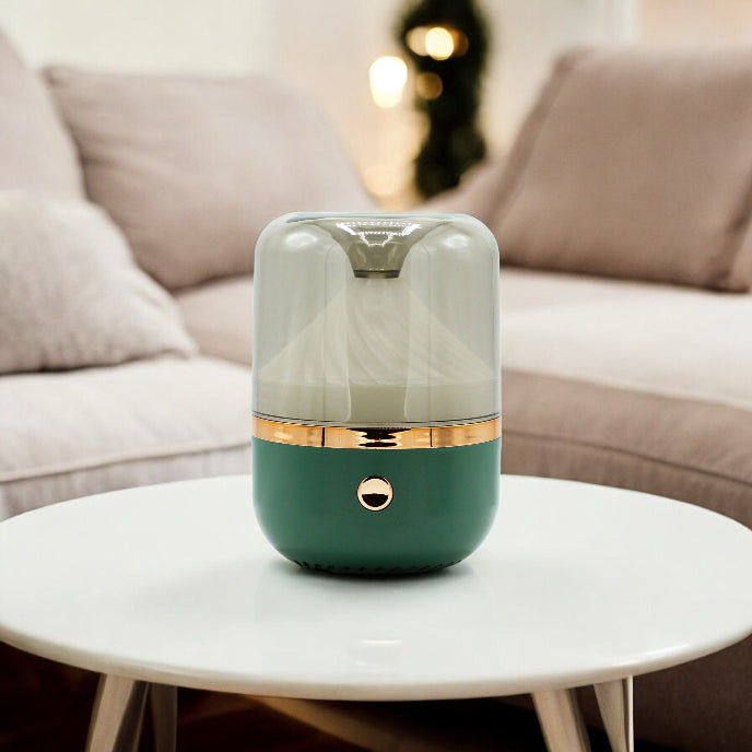 Green and gold diffuser on a white table with a blurred sofa in the background