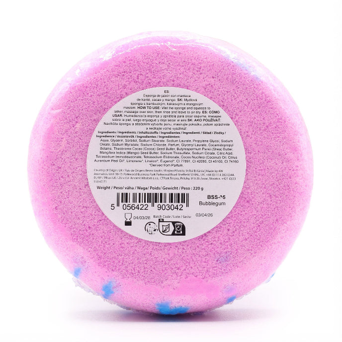 Pink bath bomb with a label on a white background