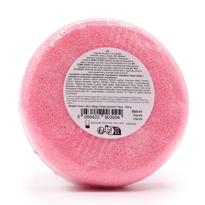 Pink bath bomb with a label on a white background