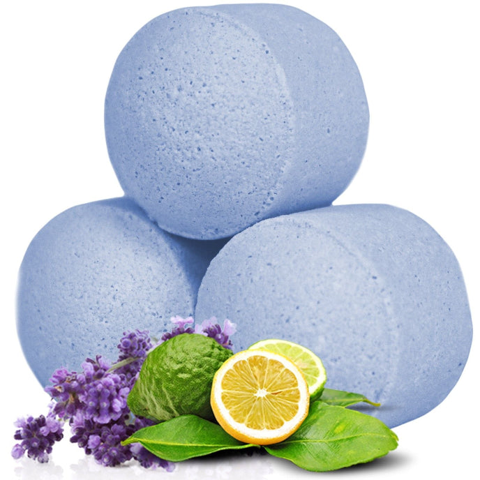 Three blue bath bombs with lavender, lemon, and lime on a white background