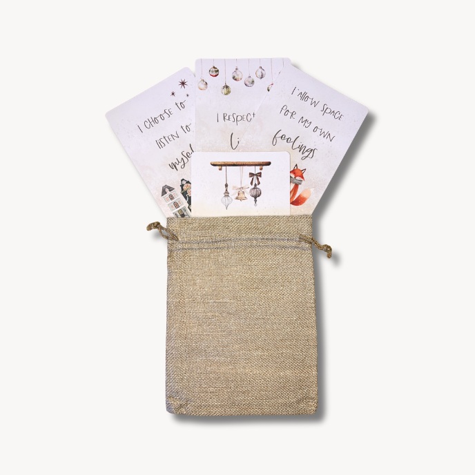 Set of cards with illustrations and text in a drawstring bag on a white background