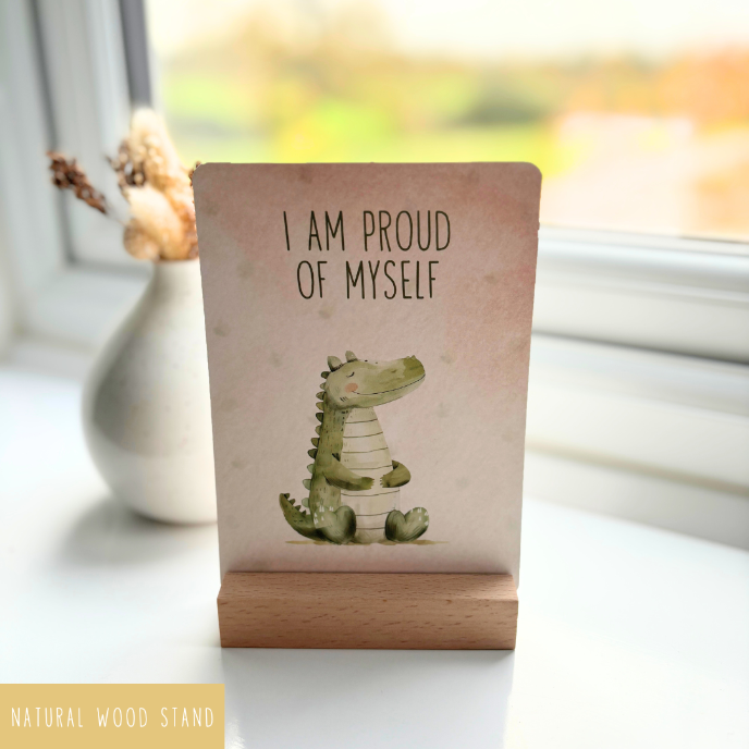 Small wooden stand with a card featuring an illustration of a crocodile and text on a blurred background