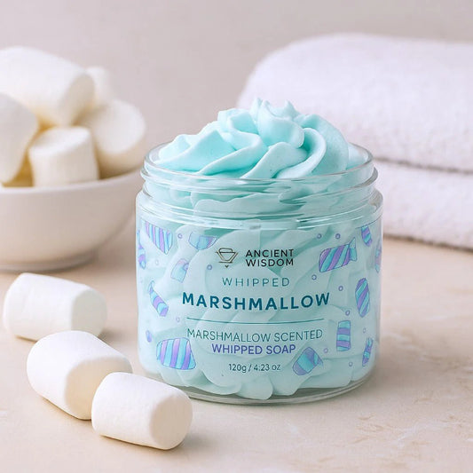 Jar of marshmallow-scented whipped soap with marshmallows around on a light background